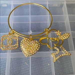 Gold plated bangle with charms